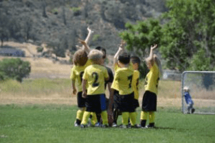 Youth soccer team wearing yellow jerseys